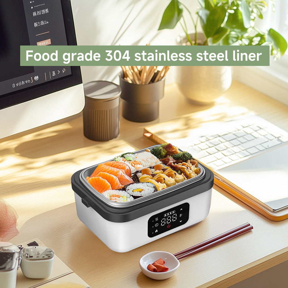 Electric lunch box with food on a desk, featuring a food grade 304 stainless steel liner.