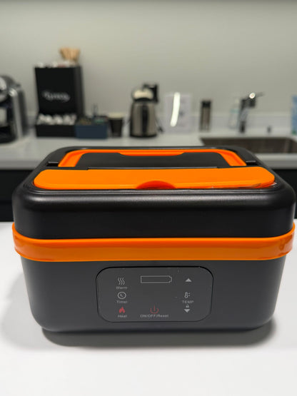 Black and orange electric lunch box on a kitchen counter
